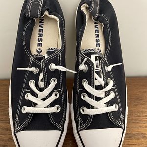 Never worn. New w/o tags or box. Navy Converse slip on sneakers.
